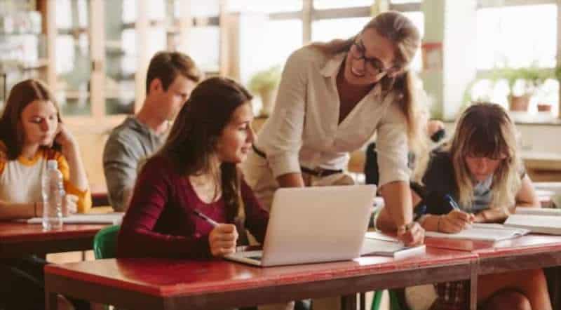 a teacher causing her students to learn